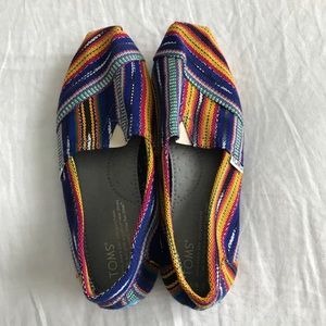 Multi colored TOMS slip ons